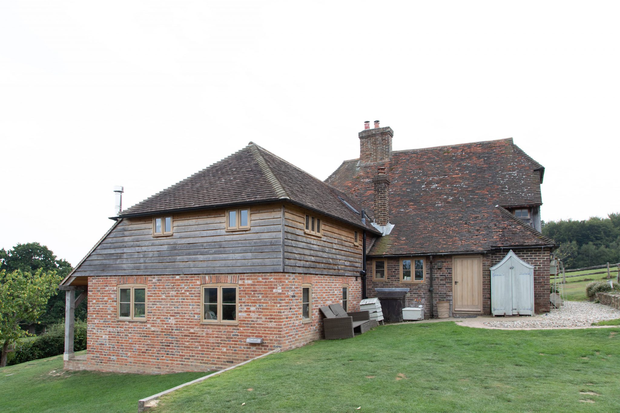 Extension to Grade II listed cottage, new stable block and garage, East